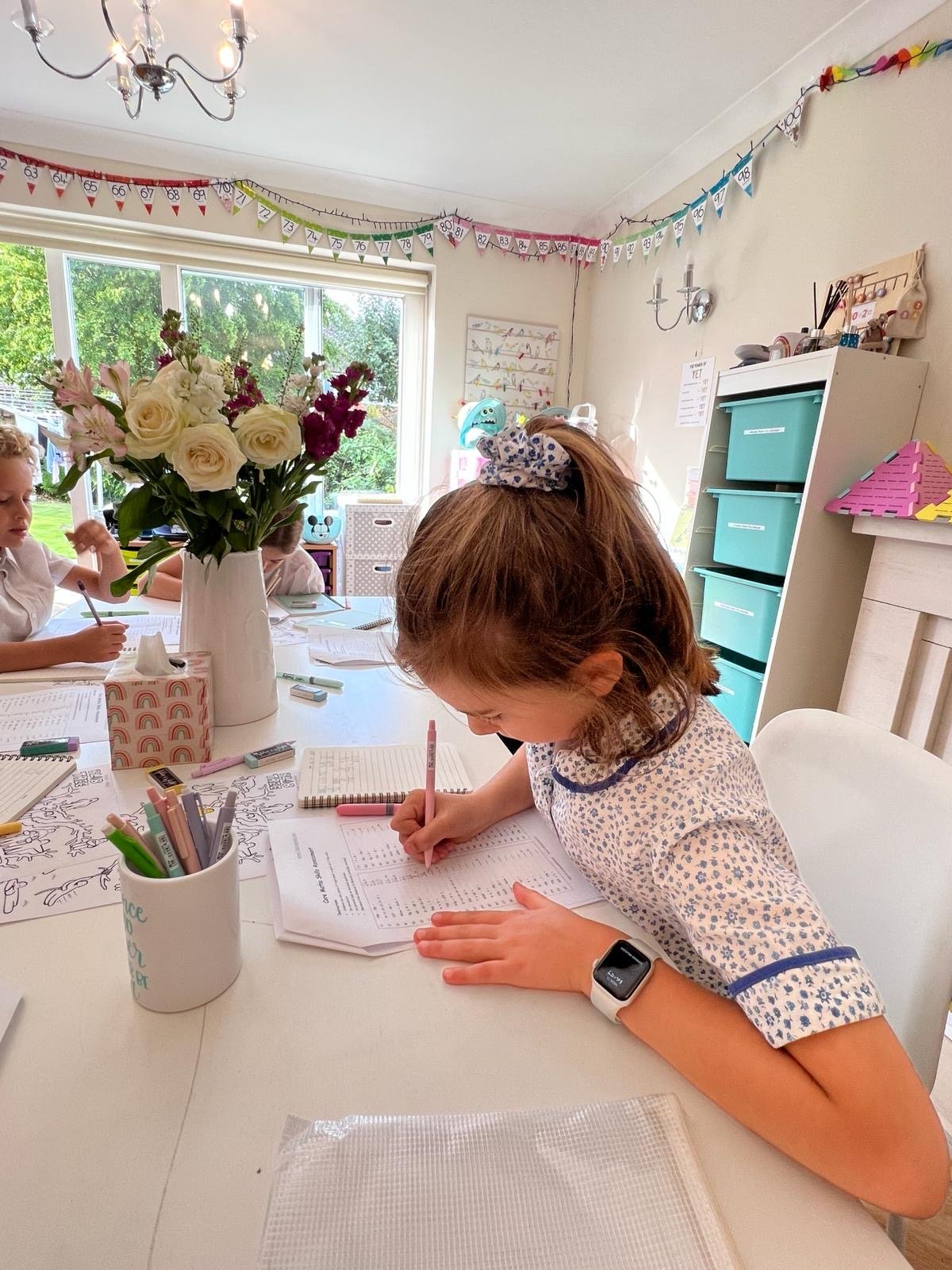 Female student working on table writing